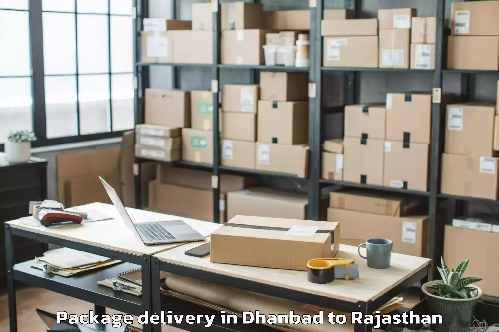 Trusted Dhanbad to Sanchore Package Delivery